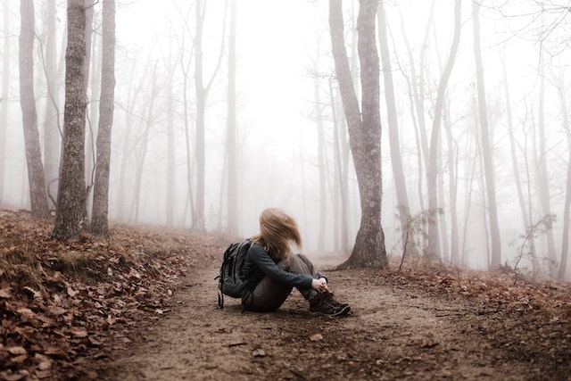 a girl alone in the woods