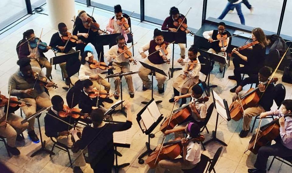 Small string orchestra of children and adults